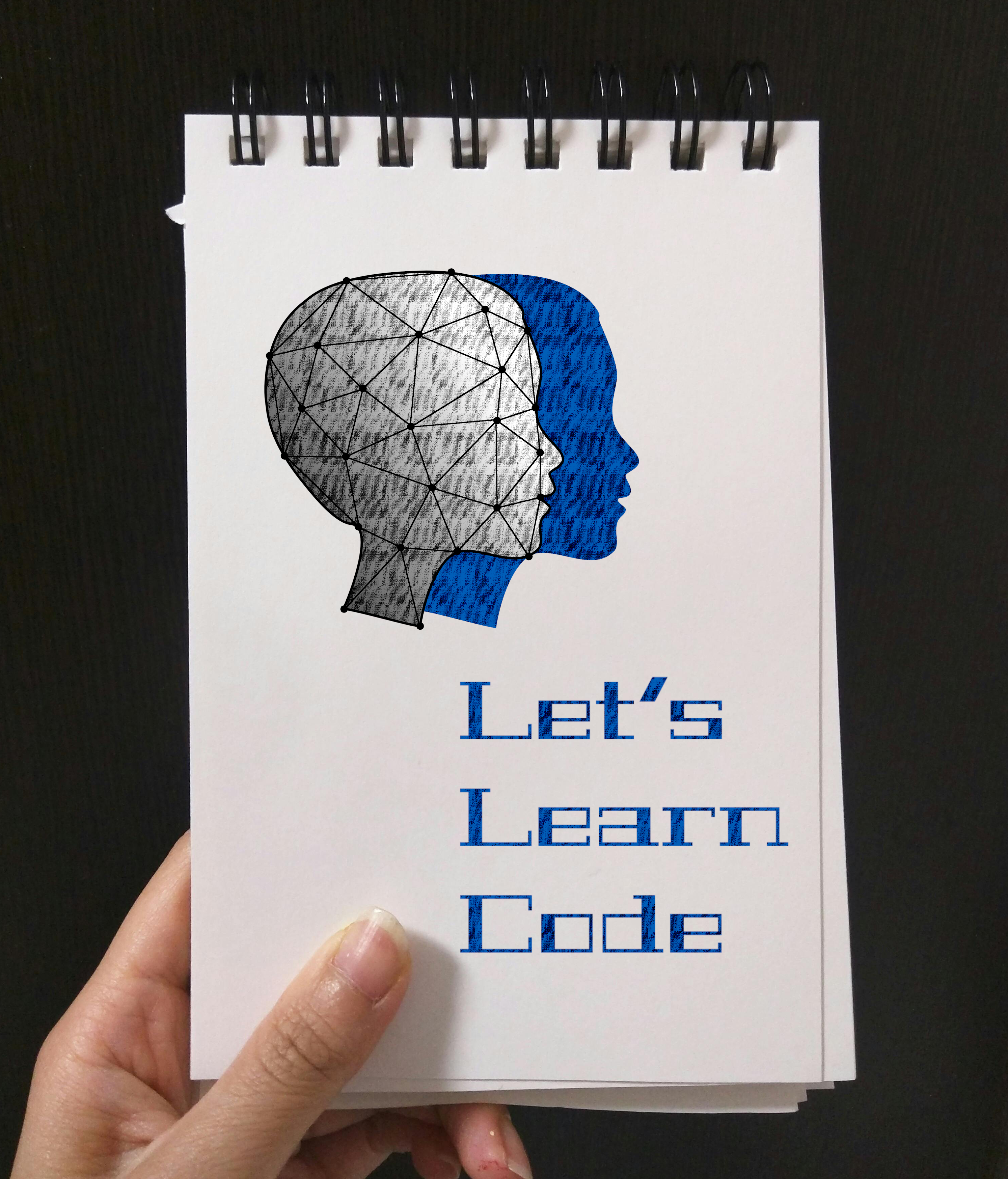 Notepad with Let's Learn Code and LDD icon on it