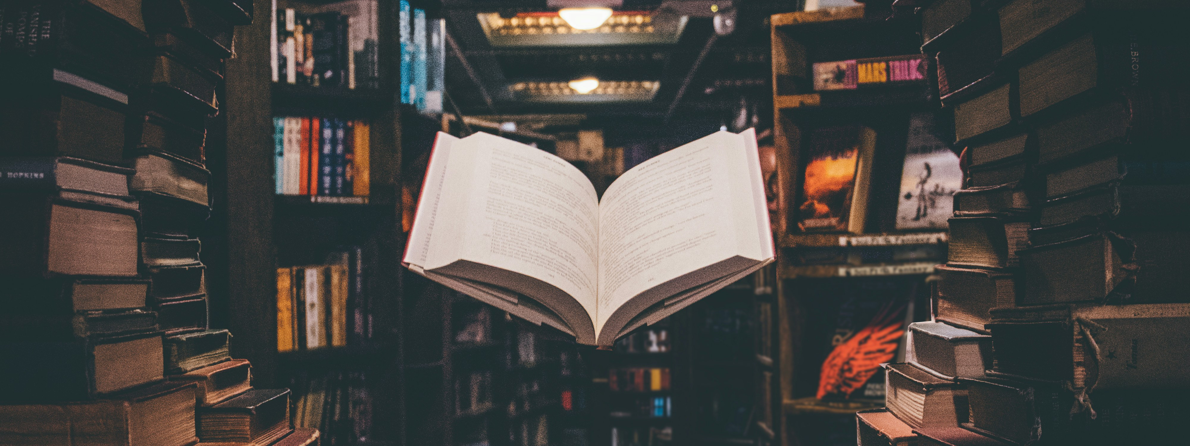 Book flying through a library